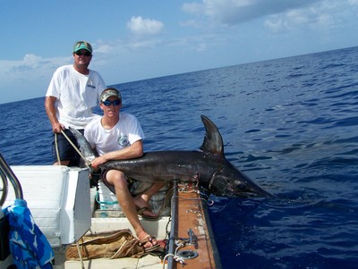 Capt. Billy and Jeremy with his Sword