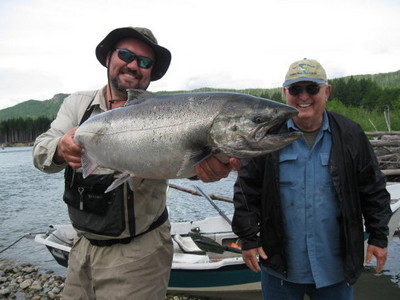 Photo of the Week: Current Chinook: Here's a recent photo of a  happy client, John Sartinsky, and  Dustin Kovacvich  of Nicholas Dean Lodge holding a 25 lb Chinook Salmon caught last week on the Kitimat River. John's wife Harriet woke up one morning in Ja