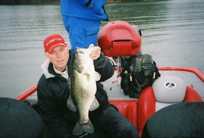 Pro guide Joe Joslin with 8 pound largemouth that hit a jig n pig in 15 ft on a recent rainy day on The Bend. The fish was immediately released.