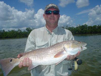 Capt. Andy Cotton caught and released this nice red, his personal best on a fly, while fishing Charlotte Harbor with Capt. Rick Grassett.