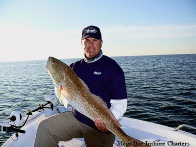 Capt. John with a 30+lb Redfish