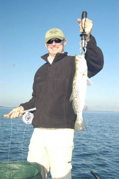 Bryan Beebe, from Sarasota, FL, with a nice trout caught and released on a fly in Sarasota Bay while fishing with Capt. Rick Grassett.