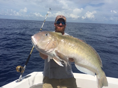 Capt Adam with a monster golden tilefish caught deep drop fishing