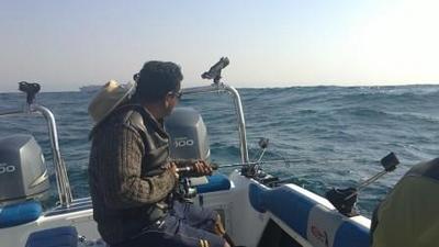 Angler facing a large swell