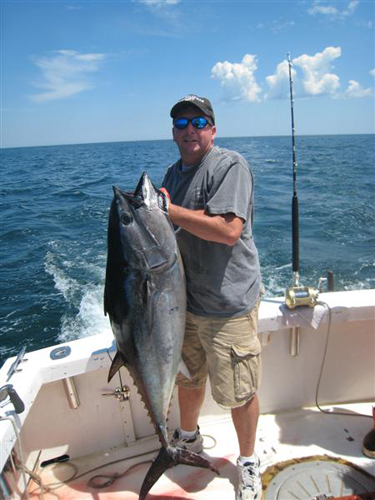 Captain Curt with a nice 85 LB tuna caught aboard the RELENTLESS