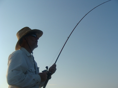 Gentleman with a big bluefish on 12 lb. test line.