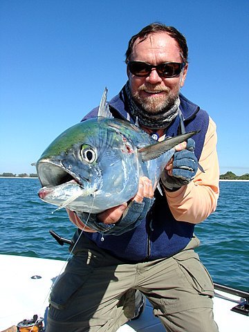 Steve Gibson photo-Capt. Rick Grassett with a little tunny caught and released on a Grassett's Snook Minnow fly off Casey Key.