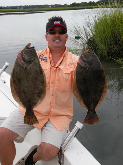 Capt. Jot Owens with two nice five pound Flounders.