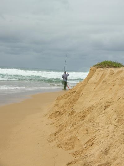 An angler takeing advantage of the new opening to Cuttagee Lake.