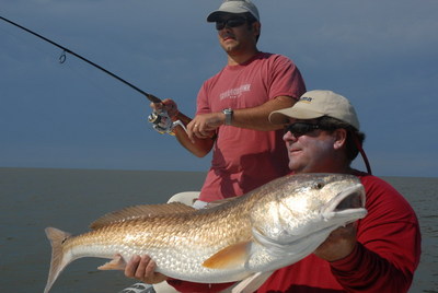 Capt. Mike displays Redfish Darren just caught