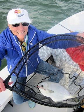Diane Muhlfeld, from Sarasota, FL, with a nice pompano caught on a CAL jig with a shad tail while fishing Sarasota Bay with Capt. Rick Grassett.