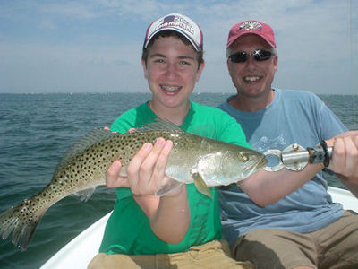 Dirk Greene, from MI, with his dad, Perry Greene, and a nice Sarasota Bay trout caught on a CAL jig with shad tail while fishing with Capt. Rick Grassett.