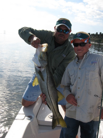 Trace & Paul Meding with the snook Trace caught and released