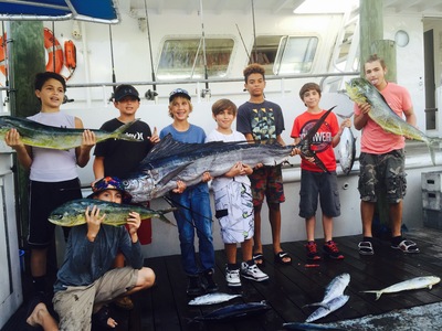 Kids with a great catch on a rough fishing day
