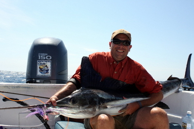Driss Bennani and a fly caught marlin.