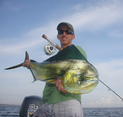 This is Nick Rizopoulos who is here fishing with his dad John showing off a nice dorado that was caught on the fly.  Nick and his dad have caught many species this trip including dorado, bonita, rooster fish, lady fish, as well as jacks.  They are not don
