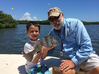 Brody with a nice black drum caught along the mangroves in Fort Pierce.