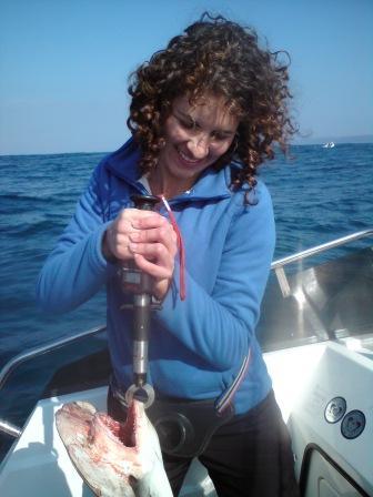 Lady angler with Hammerhead Shark