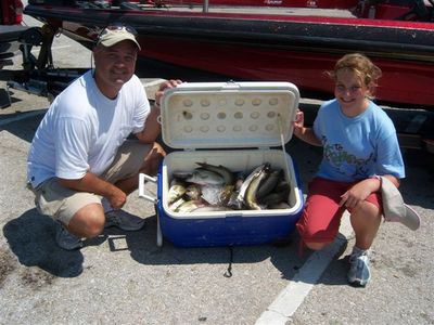 Jon and Jennifer and limits of sand bass and 8 catfish
