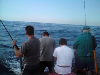 4 Anglers doing battle with a multiple hook up