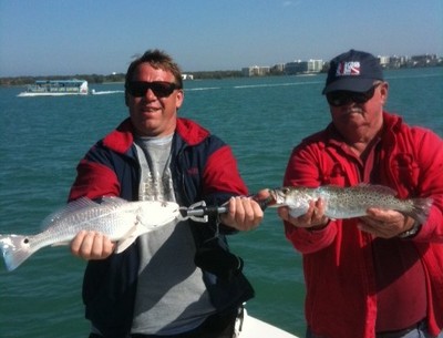 Karl and Joe with trout and redfish