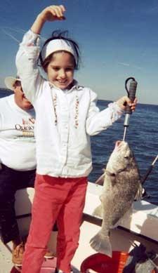 Dancing with her Drum on top of the cooler.