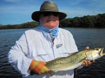 Lynn Skipper, from Apollo Beach, FL, with a 4-lb trout caught and released on an EP style fly while wading a Sarasota Bay flat with Capt. Rick Grassett.