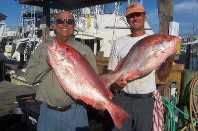 Capt. Mike Thierry and Mark Clark with sow snappers