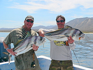 Christian Motta and Dr. Rick Angelo showing off  two nice fly caught rooster fish