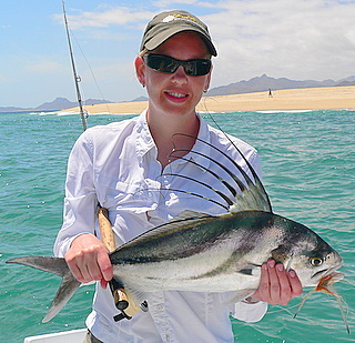 Angie Clark with her first rooster fish on a fly