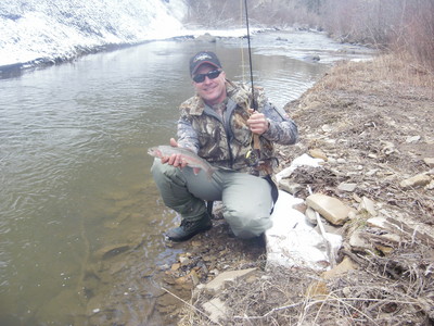 Ron with a nice trout on a snowy morning.