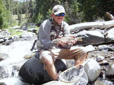 Logan on a tiny stream at 9,000 feet!