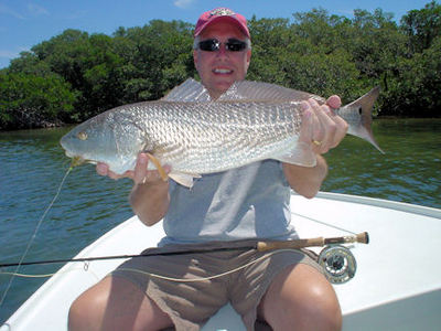 Perry Greene, from MI, with his first red ona fly. He caught it on a Grassett's Flats Minnow fly while fishing Sarasota Bay with Capt. Rick Grassett.