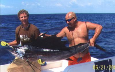 Ron Tindall & dad Ronnie with a sail they caught on a recent visit to Ft. Pierce.