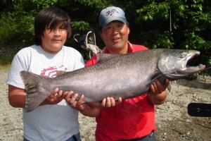 Freshwater guide Ron Wakita (R) with his son and a nice Chinook Salmon landed on the Kitimat River