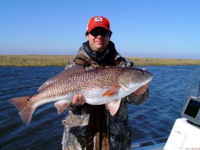 Mike with his biggest marsh redfish.