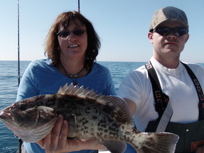 Woman anglers catch Grouper on Fat Cat.