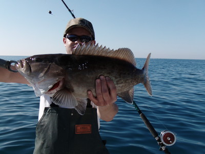 Capt Brad Masters with a keeper Gag Grouper on Fat Cat