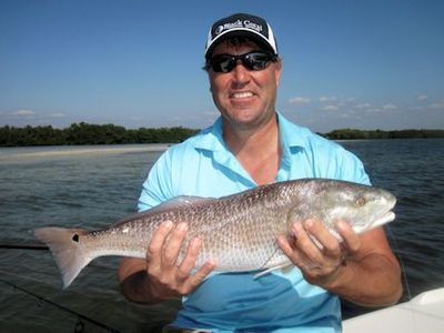 Stephen Liska, from Naples, FL, with a nice red caught and released on a CAL jig with a jerk worm while fishing the backcountry of Gasparilla Sound with Capt. Rick Grassett.