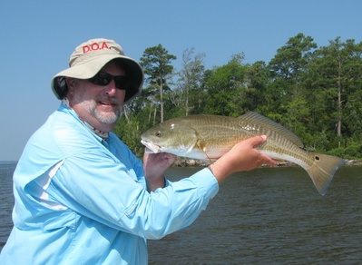 Capt Gary with an early Aug redfish