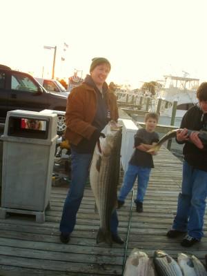 Becky with her 52lb Striper.