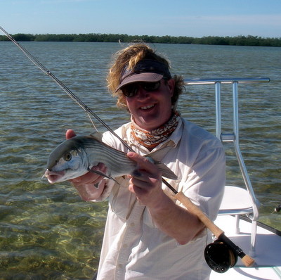 Mark raisler poses with his first bonefish of the New Year!