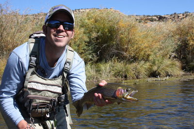 Steve Baird showing of a fish from the backwates on the Juan.