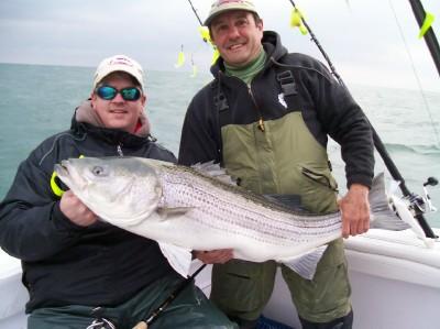 Me with Eric Naig from Pure Fishing with a 35lb Striper