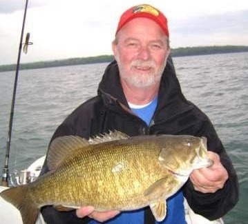 Captain jim Hanley with a 7.2 lb Lake Erie smallmouth bass