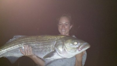 Lauren with a nice Cape Cod Bay striped bass.