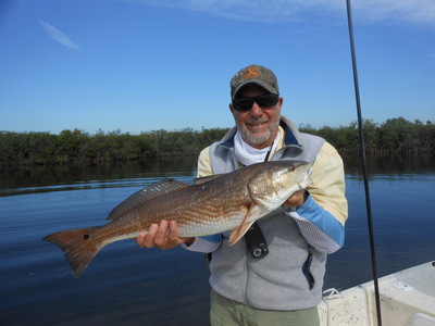 Lynn with a big red fish.