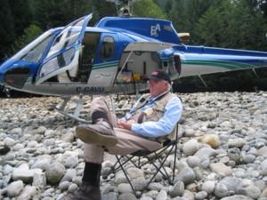 What do you suppose this gentleman is thinking, or looking at?  Could it be the one that got away?  Could he be looking at his partner landing the big one?  Or is he just resting after catching just too many fish?