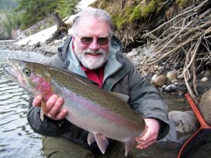A little story about this fish:  I caught this fish on a light spoon.  It hit real hard and fought like heck.  When Rob got it into the net for me we looked at the fish and we could not tell if it was a male or a female.  It had a funny looking head, not
