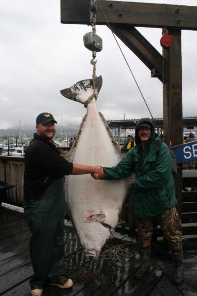 Captain Jj congratulates David Hicks for the catch